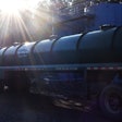 Tank at Simsboro well-site with John McGee Trucking tanker