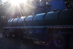 Tank at Simsboro well-site with John McGee Trucking tanker