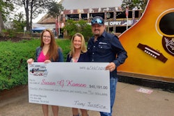 Pictured during a check presentation Thursday outside the Grand Ole Opry in Nashville, Tennessee (from right): Trucker-songwriter Tony Justice and his wife, Misty, with April Douglas of the Susan G. Komen Foundation