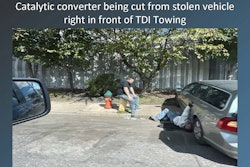 Catalytic converter being cut from a stolen vehicle in front of TDI Towing