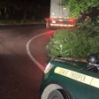 Vermont State Police vehicle parked behind the stuck semi-truck on smuggler's notch