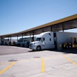 trucks fueling at truck stop