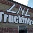 LNL Trucking logo on building