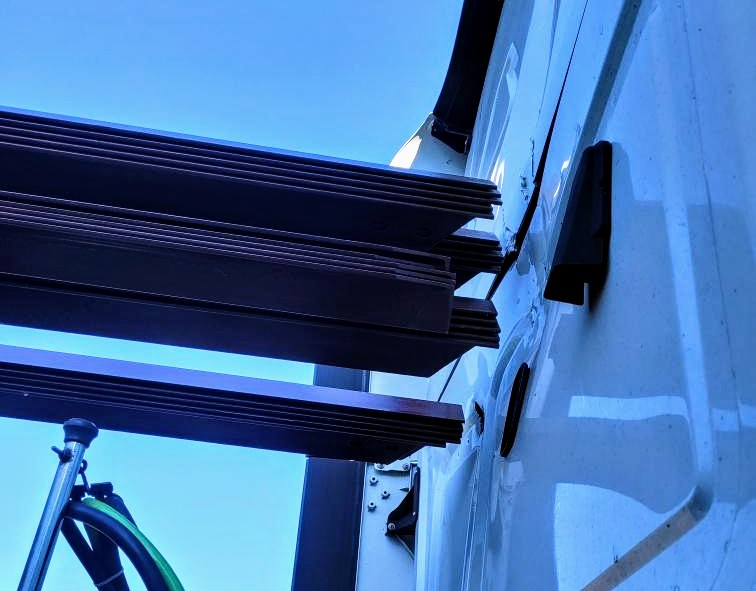 Angle iron load shifted into back of truck cab automatic emergency braking