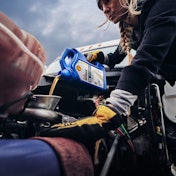 Pouring Shell Rotella T6 10W-30 into diesel engine