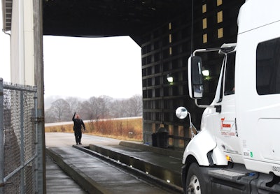 truck entering inspection barn
