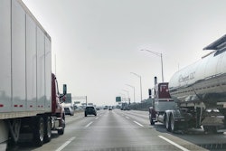 Van and tanker trucks on highway