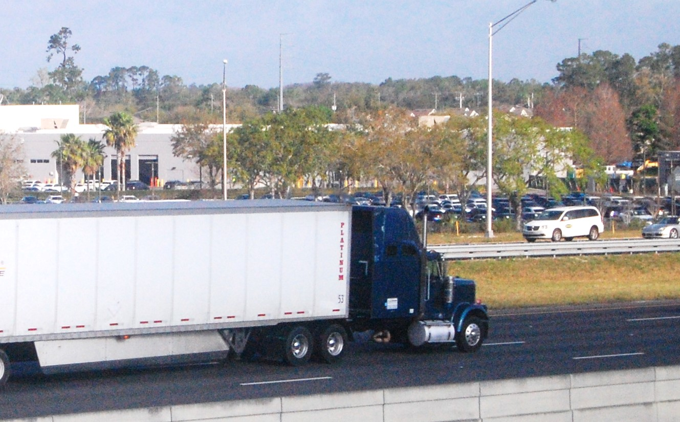 truck pulling dry van on highway