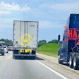 AEB illustration of highway scene with stationary bobtail in breakdown lane