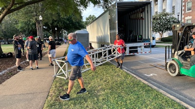 Drivers unloading Gameday equipment