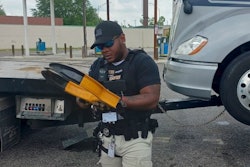 An armed A1's Towing & Hauling agent tows a truck from A Valero station in Memphis, even though the operator was on-site.