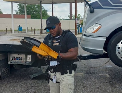 An armed A1's Towing & Hauling agent tows a truck from A Valero station in Memphis, even though the operator was on-site.