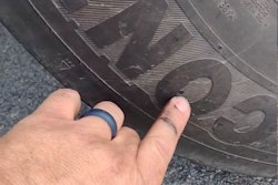 David Lucas showing tire punctures on his truck