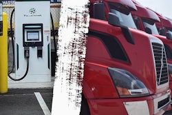 A Class 8 EV charger and used trucks lined up at a dealer