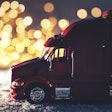 Model truck in miniature winter highway scene