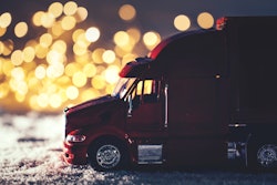 Model truck in miniature winter highway scene