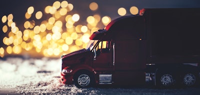 Model truck in miniature winter highway scene