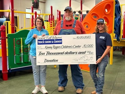 Swamp East Missouri organizers with novelty check