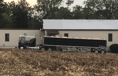 1985 Kenworth K100 and 2023 Eby hopper loaded with grain