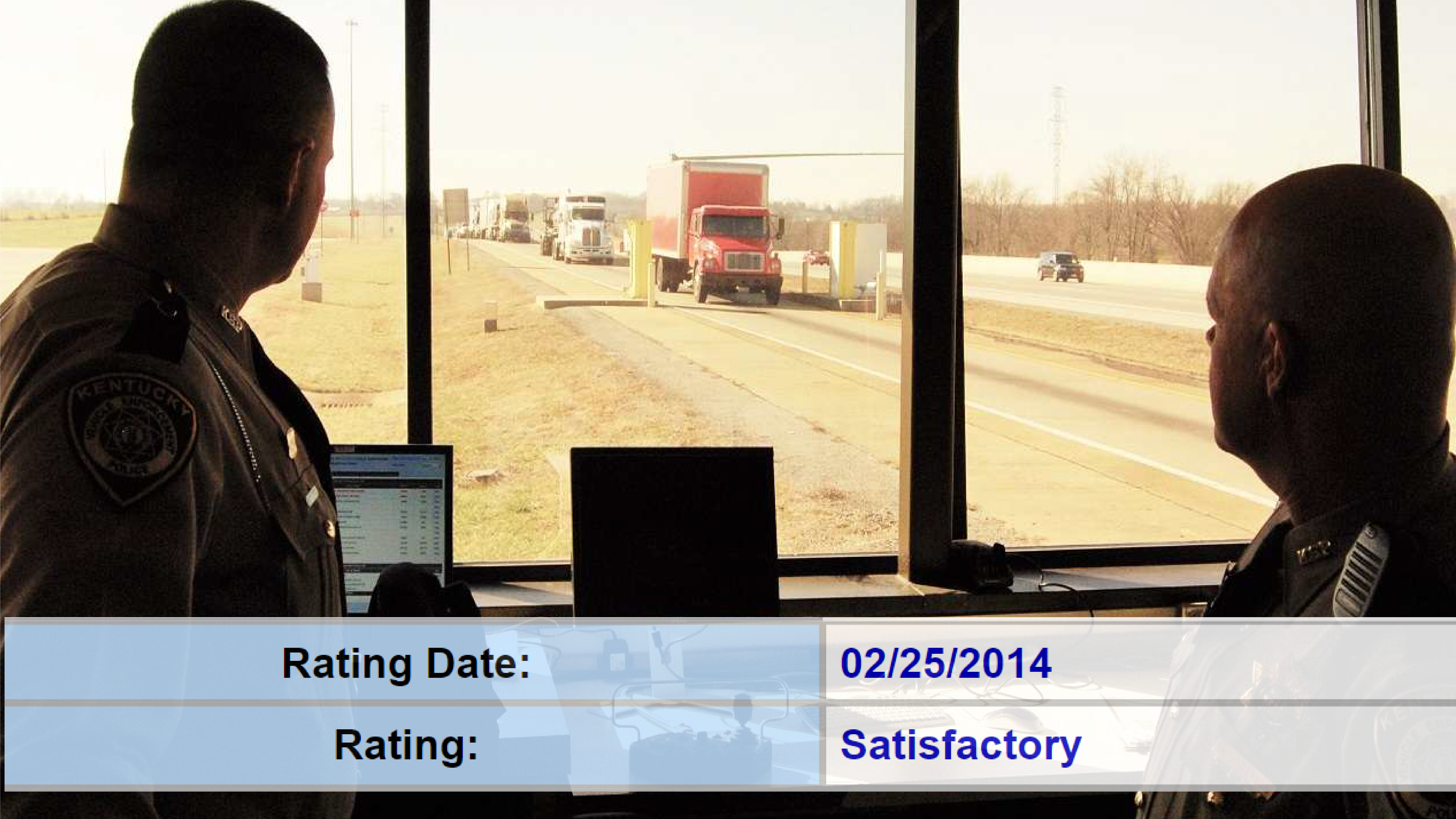 officers watching trucks at weigh station