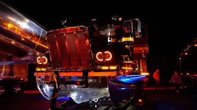 Scott Carder's Peterbilt 379 tritoon boat at night