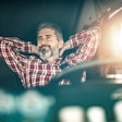 relaxed truck driver behind the wheel
