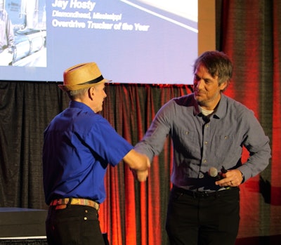Overdrive's Trucker of the Year Jay Hosty received the replica model of his 2006 Western Star 4900EX on Friday at the Mid-America Trucking Show. Overdrive Editor Todd Dills presented the model to him on the stage (shown) ahead of the Partners in Business session.