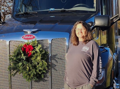 Candace Marley with her Peterbilt 579 dressed up for Wreaths Across America