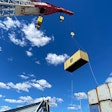 crane removing containers from the ship that caused the collapse