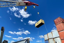crane removing containers from the ship that caused the collapse