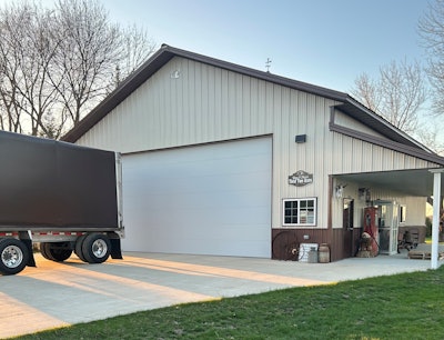 Gary Schloo's trailer backed up to his shop's bay door