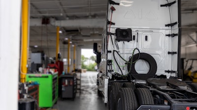 Truck in a service shop waiting to be worked on