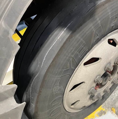 Tire with metal showing