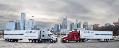 High Road rigs in front of Nashville skyline