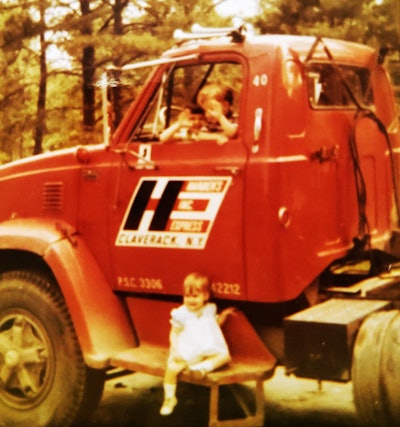 Sharon Lee as a young girl on the step of her father's truck
