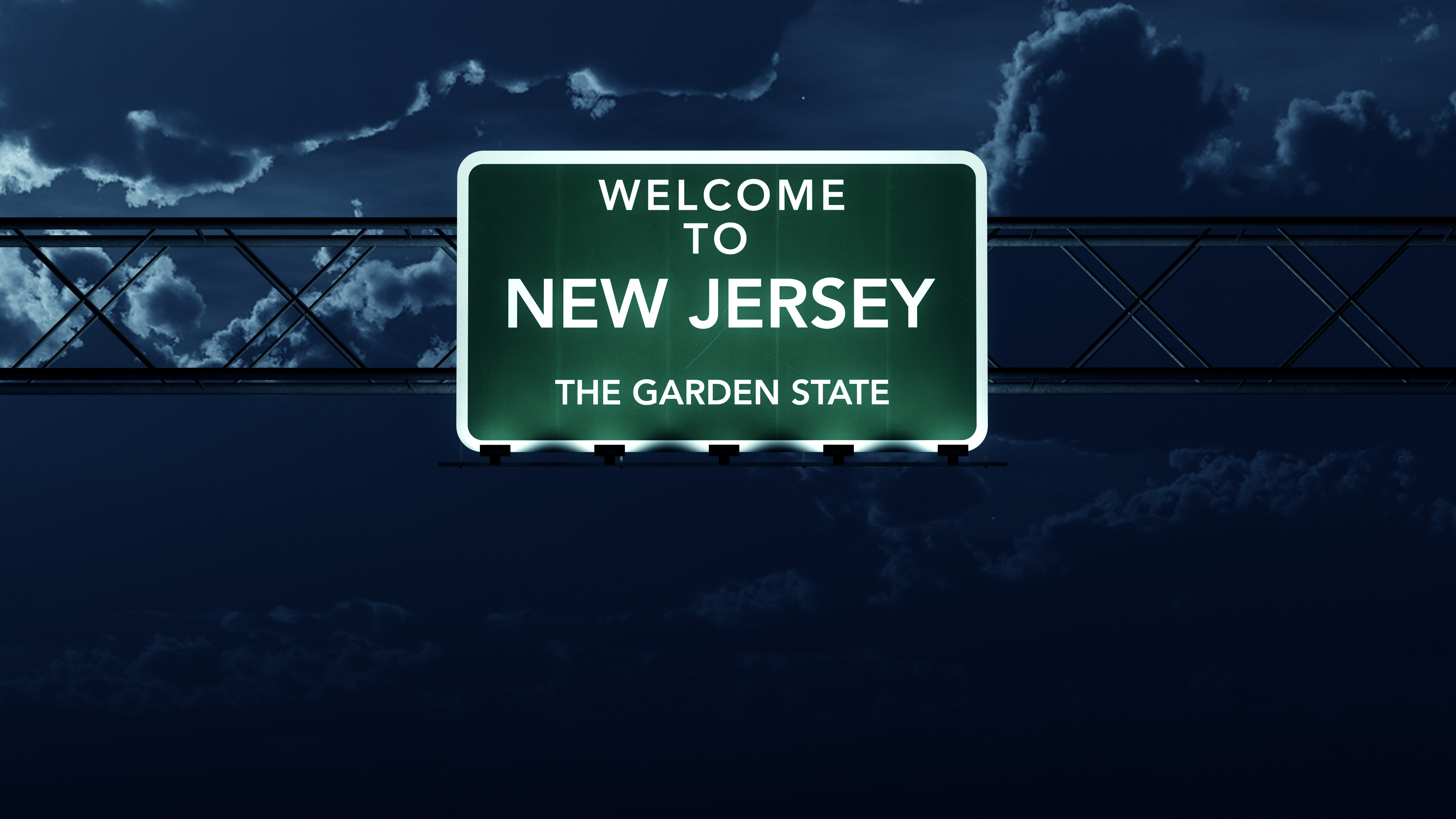 New Jersey welcome sign at night