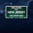 New Jersey welcome sign at night