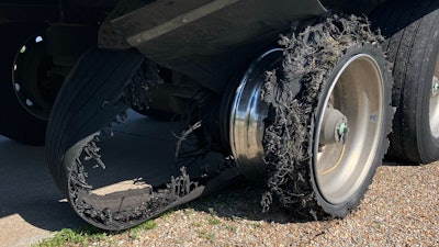 blown and shredded truck tire