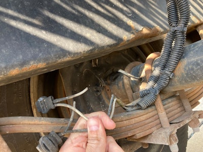 broken wires under truck