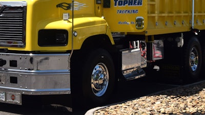 It's dressed up inside and out with numerous pieces custom-cut at Landon's direction, including the stainless panel featuring running lights toward the rear from the driver side steps.