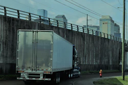 Truck turning next to highway