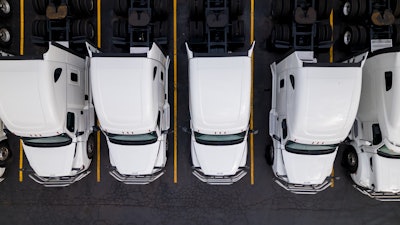 Group of white trucks from above