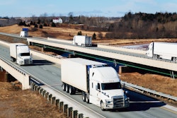 trucks on highway crossing bridges