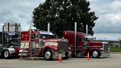 Two semi-trucks parked beside each other