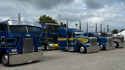 Four semi-trucks parked