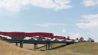 Superload moves across bridge