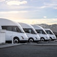 Four Tesla Semis parked