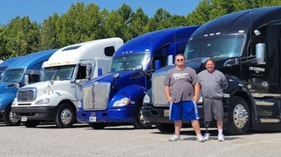 C.W. Express Wilson the elder and the second with trucks