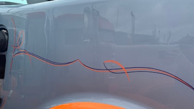 Pinstriping on Dabney Trucking's 2025 Kenworth W900L
