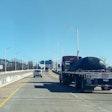 flatbed on highway bridge